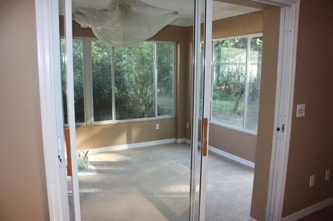 Building Photo - Unique 2/2/2 with Florida room with a/c