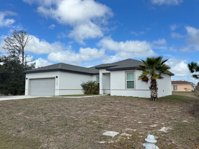 Building Photo - Spacious 4-Bedroom Home in Poinciana – Internet Included & No HOA Approval Required