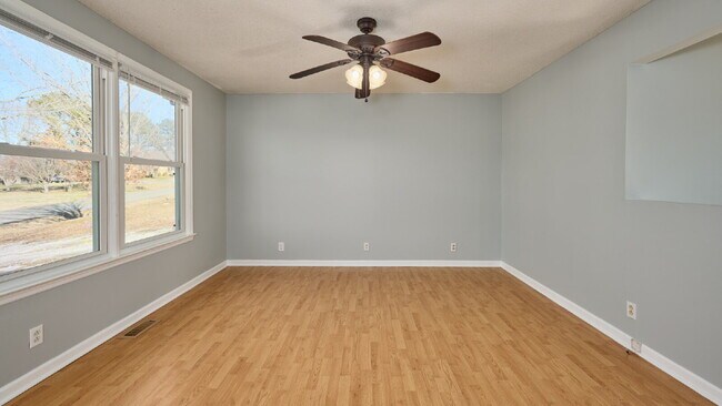 Building Photo - Now Ready : 4BR, 1 1/2BA home with fenced in back yard and storage building.