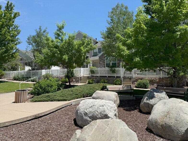 Front door faces rock park, grassy area, and gazebo - 14239 Pikeminnow Pl