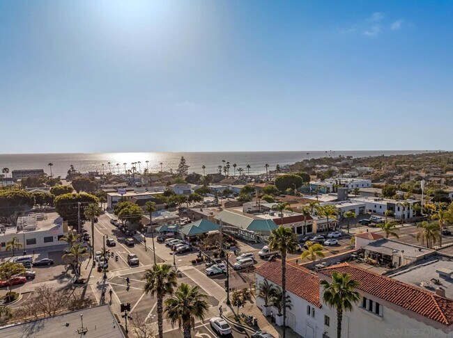 Building Photo - THE BEACH IS YOUR BACKYARD! Light & Bright...
