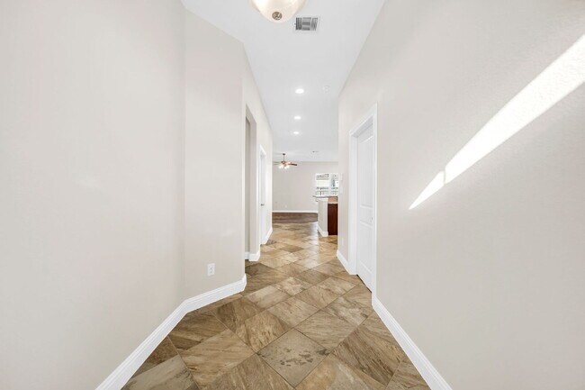 Building Photo - Welcome to this well-kept, single-story gem located in the Villas of Mia Lago!