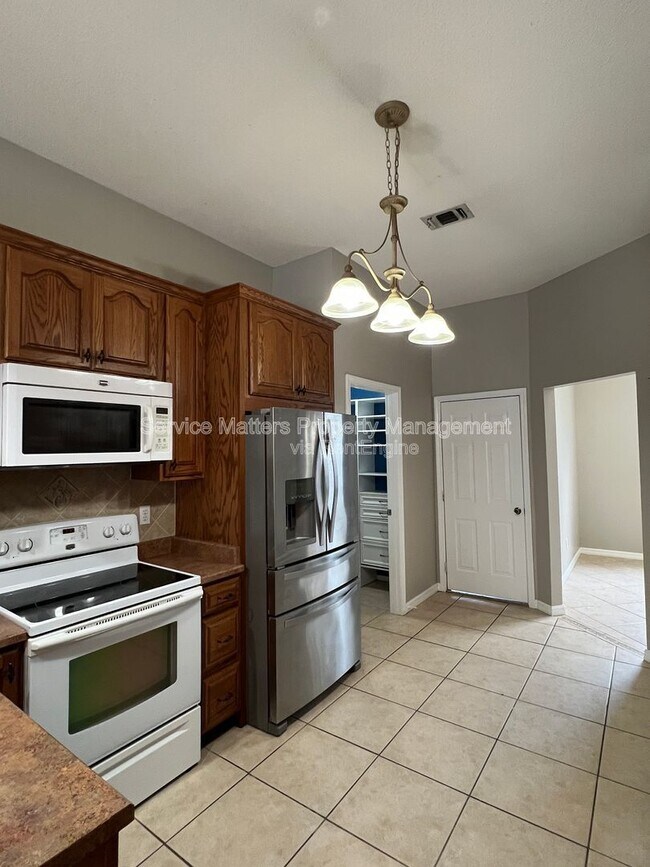 Building Photo - 5784 Twisted Oak Ct