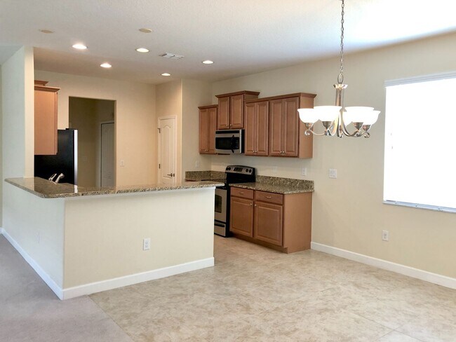 Building Photo - Beautiful 3/2 Spacious Home with a Covered...