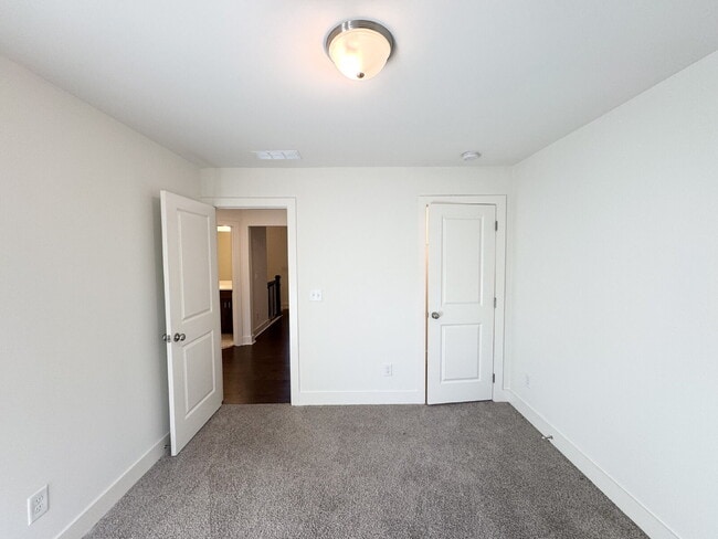 Building Photo - Stylish 3BR Townhome with Private Yard & T...