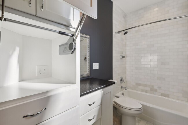 Each main level bathroom has an appliance garage with 4 plug in outlets. - 924 Eleanor Ave
