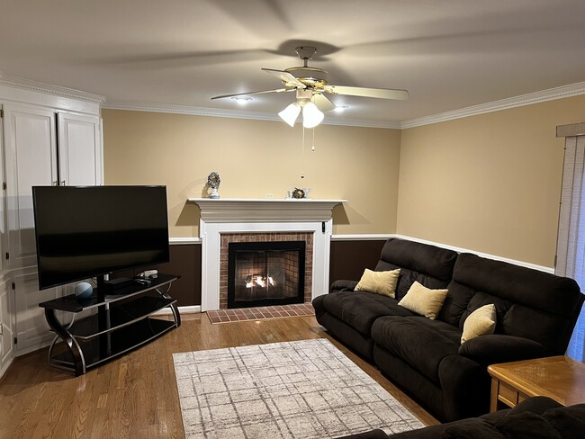 Family room and fireplace - 141 Players Ct