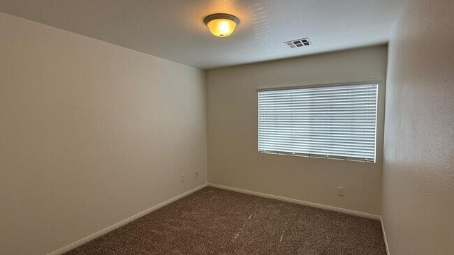 Building Photo - New flooring and freshly painted 4 bedroom home