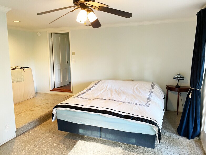 Primary Bedroom with a ceiling fan - 15341 Cohasset St