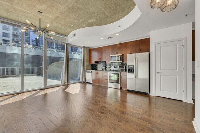 Building Photo - Stunning condo in the heart of SoBro at the Encore! Beautiful 1 bed, 1 bath on the amenity floor ...