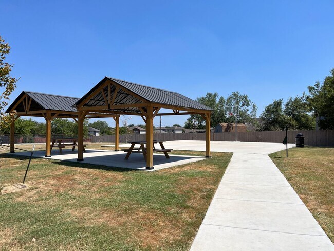 Building Photo - Move Fast! Gated Townhome Near Lackland AFB with Private Yard & EV-Ready Garage