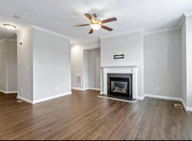 Nine-foot-ceiling living room with fireplace - 8122 Primanti Blvd