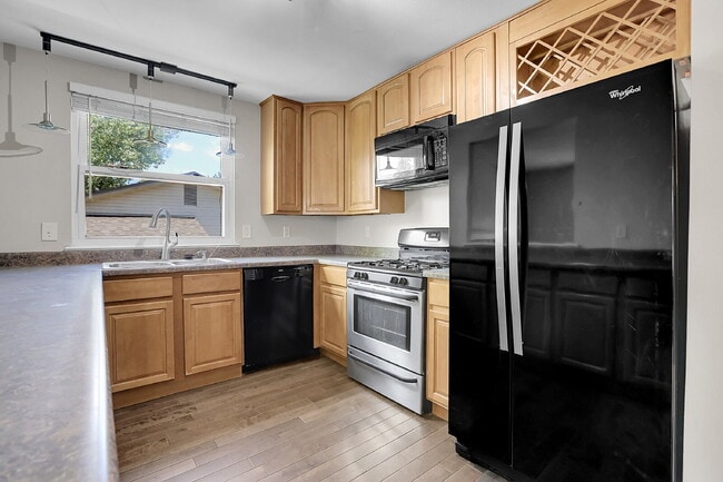 Building Photo - $2,720.95 - 4 bed, 2 bath, located in Aurora with attached Garage and In Unit Washer and Dryer!