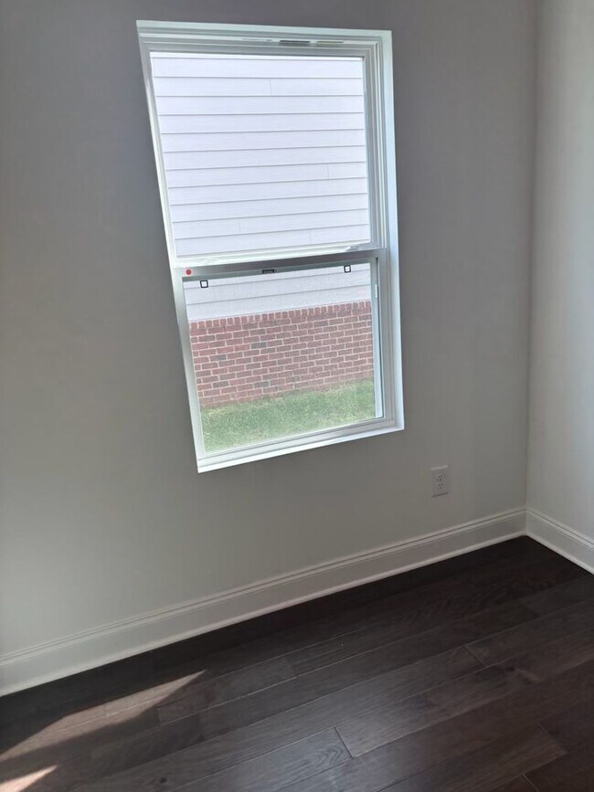 Building Photo - **BE THE LUCKY ONE TO LIVE IN THIS 2024-BUILT END-UNIT TOWNHOME IN A RESORT-STYLE COMMUNITY**