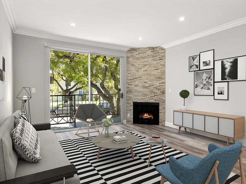 Hardwood floored living room with balcony access and stone walled fireplace. - Clarington Court