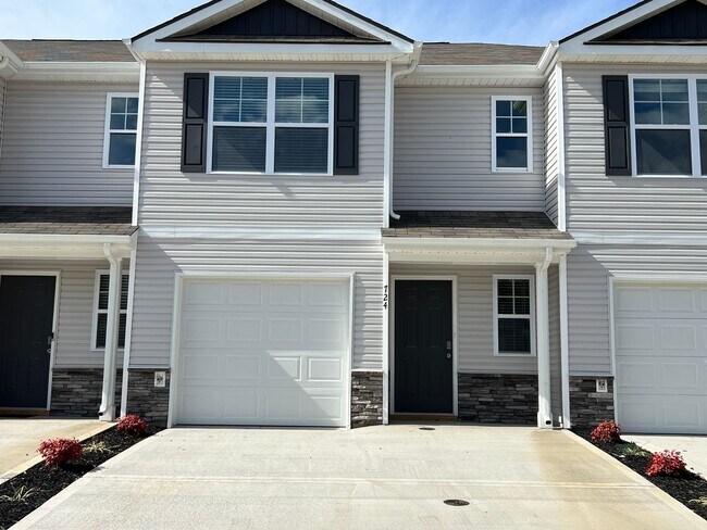 Building Photo - Beautiful New Construction 3 bedroom 2.5 Condo   with garage- Water, trash & sewer incuded!