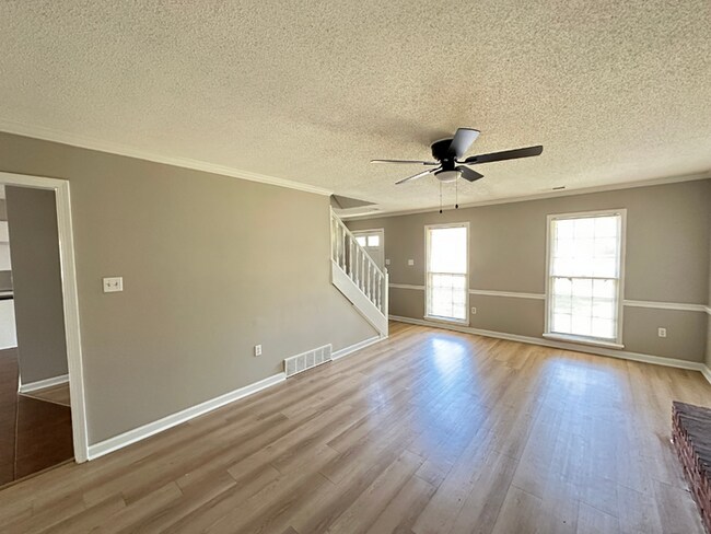 Building Photo - Charming 3BR/2BA Near Southwind | Hardwood Floors, Brick Fireplace, Bay Window & 2-Car Garage