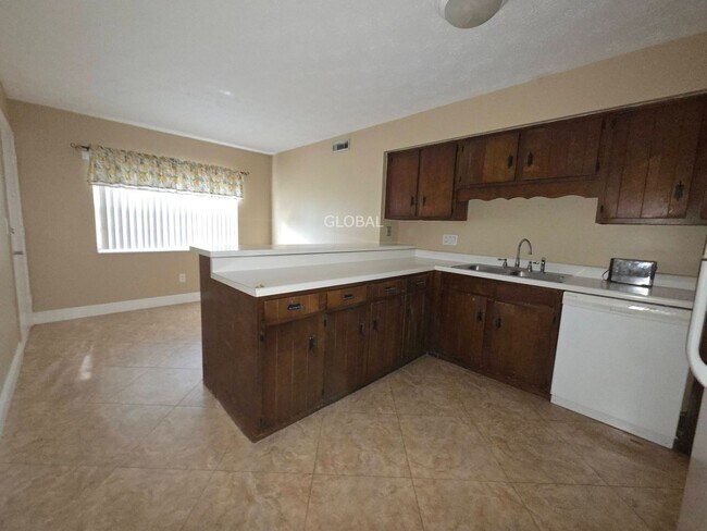 Building Photo - Lakefront First-Floor Condo in Camelot by ...