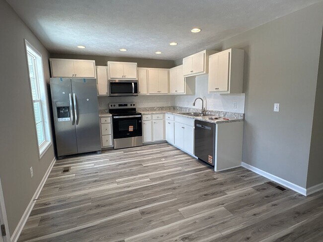 Building Photo - Charming New Home with a Rocking Chair Front Porch!