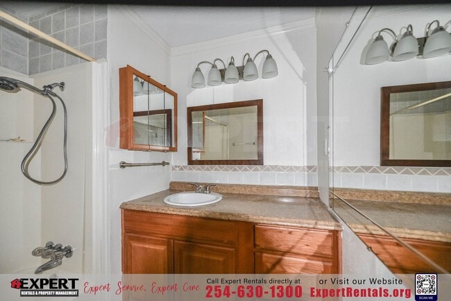 Building Photo - A cozy 3-bedroom, 2-bathroom home nestled on a corner lot