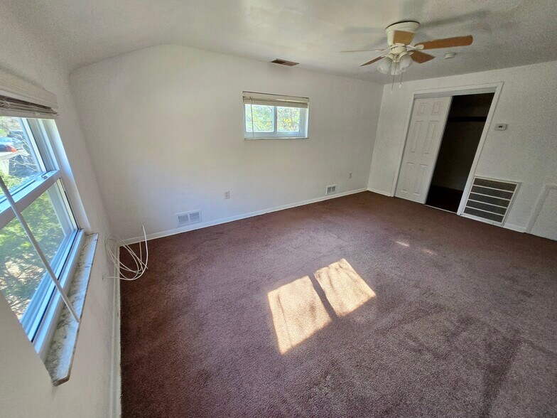 Living room with spacious walk in utility/storage closet - 2612 Louisiana Ave