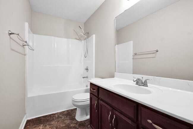 Building Photo - Pet Friendly Three Bedroom with Bonus!