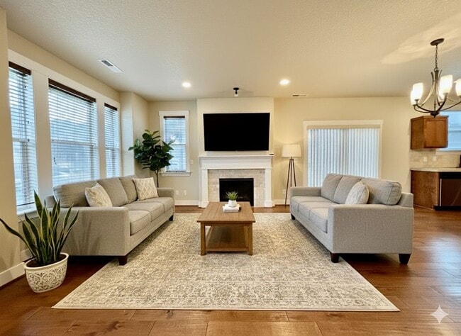 Building Photo - Modern 4-Bedroom Gem | Maintenance-Free Living & Private Side Yard!