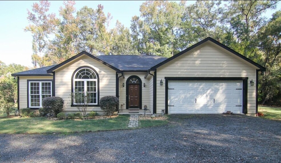 This 1.4 acre property n a tranquil neighborhood offers the perfect blend of privacy and convenienc - 5474 Bankston Lake Rd