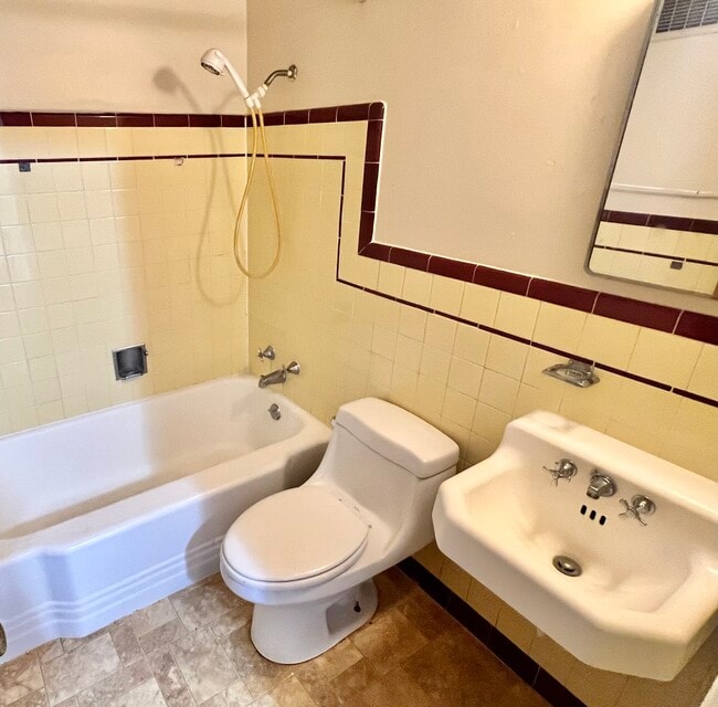 Experience timeless elegance in this vintage-inspired bathroom. - Hillside Apartments