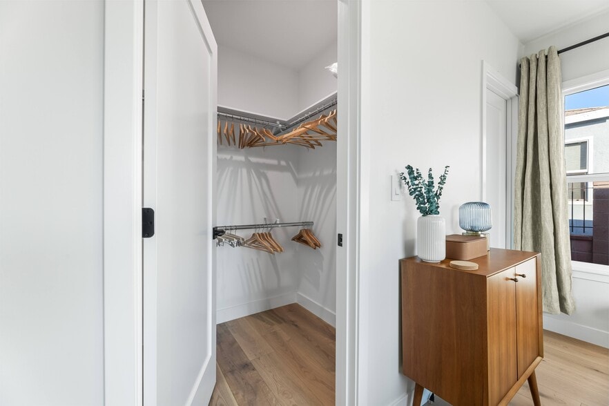 Walk-in closet in Master bedroom with en-suite bathroom. All West Elm furniture and walk-in closet. - 1823 N Ditman Ave