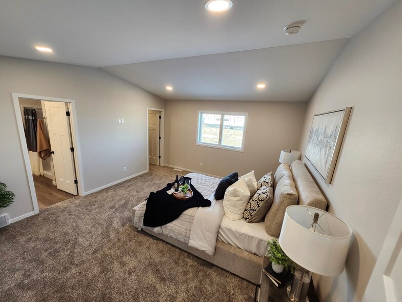 Extra large primary bedroom looking to closet and bathroom - 5318 Welder Ave