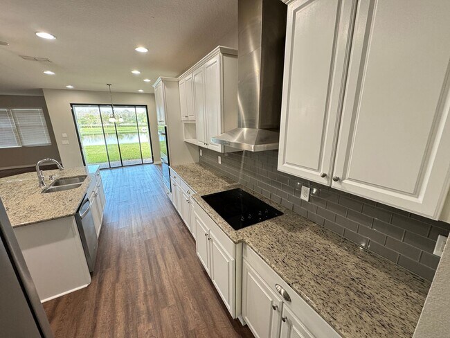 Building Photo - $300 off of a month of rent!! Experience the Epitome of Lakeside Luxury Living — For Rent in Narc...