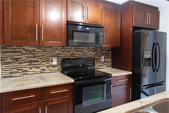 Building Photo - 3799 Cocoplum Cir