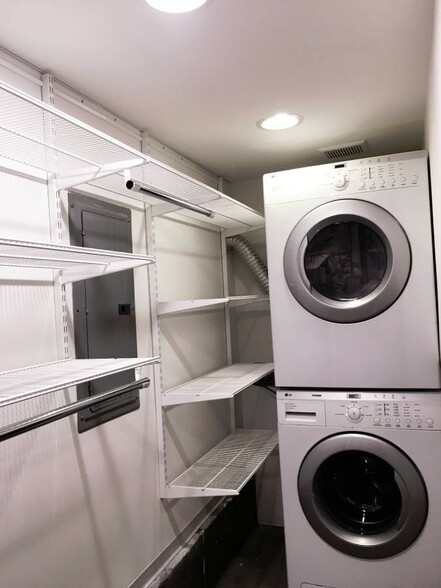 Customizable Elfa shelving in laundry room with LG washer and dryer - 6606 Corson Avenue South