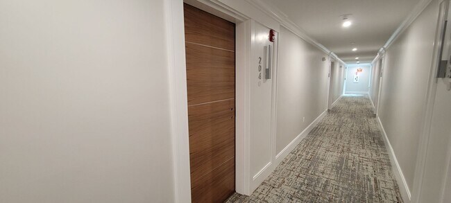 Building Photo - Large 2bd/2bath with Garage parking! Steps to Commuter Rail!