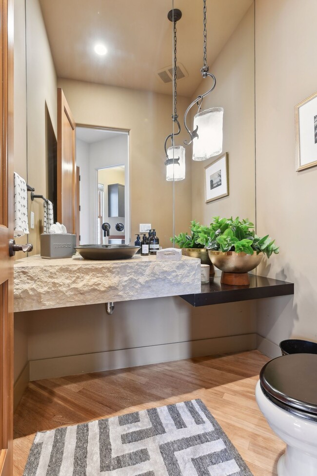 Main floor half bath with floating counter - 745 Rice St E