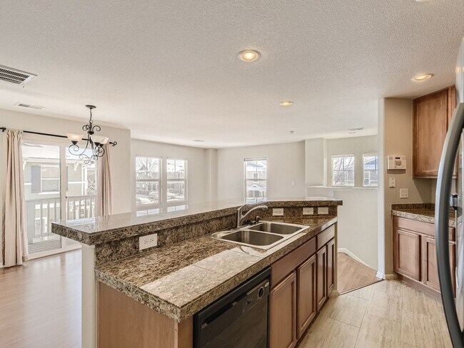Building Photo - Evolve Real Estate: Spacious 2 Bed 2 Bath Condo with Attached Garage in Parker!