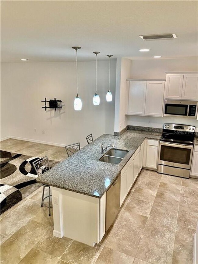 Building Photo - There’s No Place Like This 2-Story 3 BR, 2.5 BA Hidden River Townhome!
