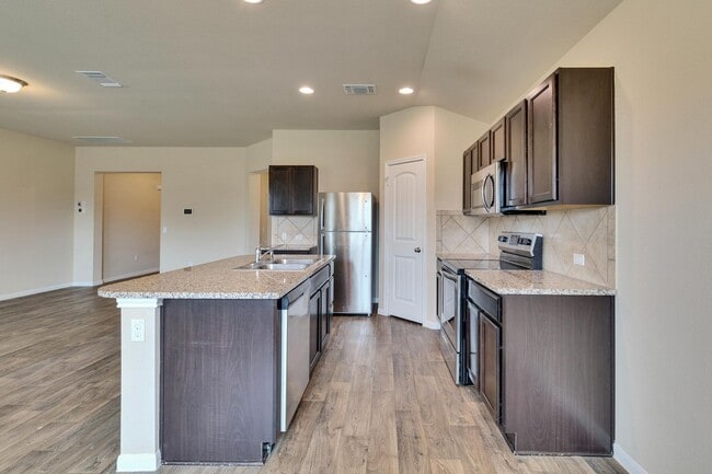 Building Photo - Modern Elegance Awaits: Discover Your Oasis in Hutto, TX