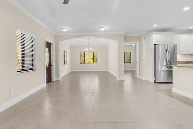 Open floor plan living room into dining room - 4400 Vanda Dr