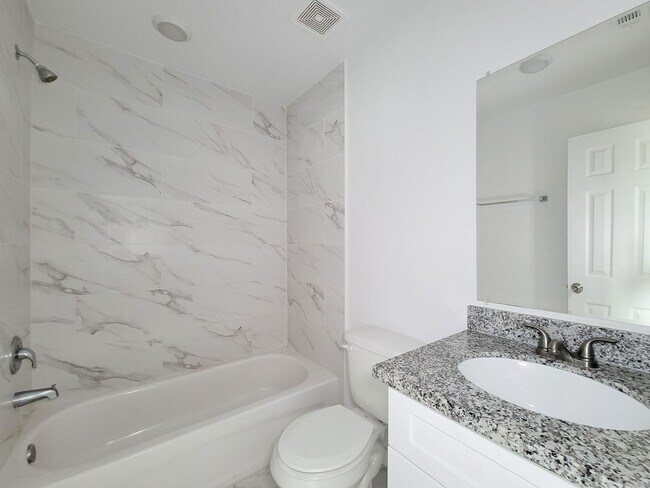 Building Photo - This newly constructed 3-bedroom, 2-bathroom unit offers modern living with 1,150 sq ft of space....