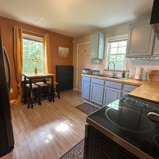 Building Photo - Charming 2-Bedroom Main-Floor Home with Fenced Yard & Utilities Included
