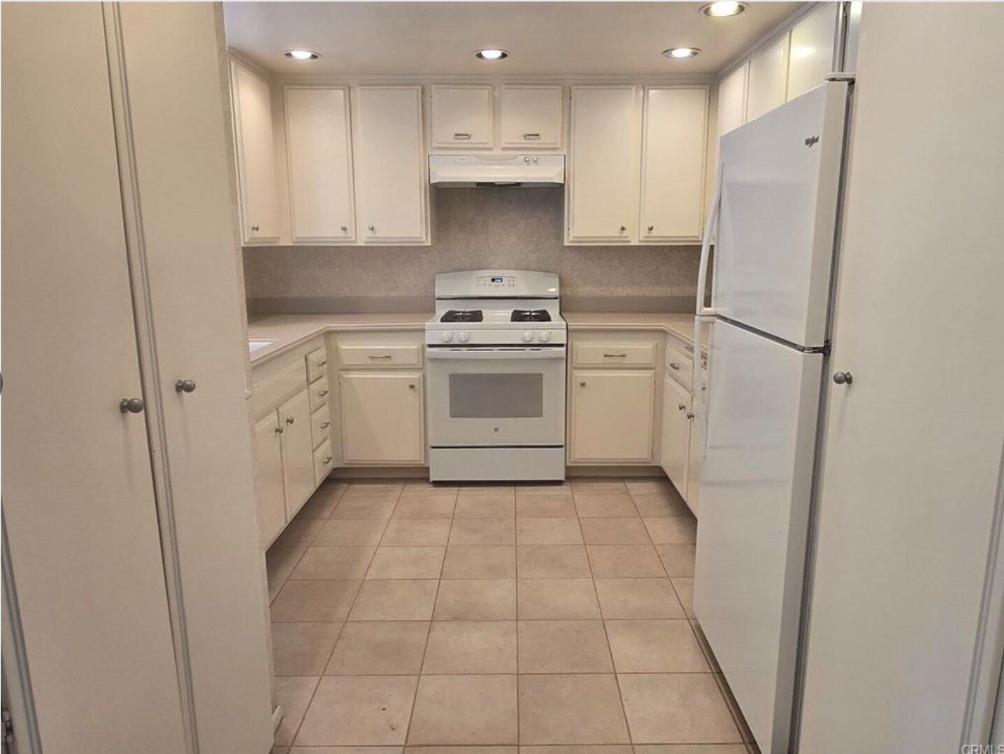 Refrigerator has ice maker. NEW custom pull out trash cabinet. - 8566 Larkhall Cir