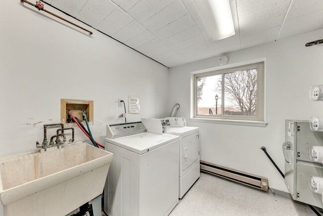 Common Laundry Area. Just a step away from 27607's main entrance! - 27607 Evergreen Run