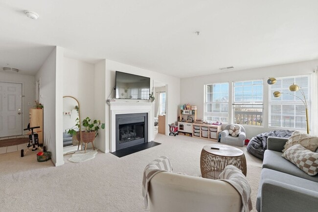 Building Photo - Bathed in natural light, this stunning second level condominium offers an effortless blend of com...