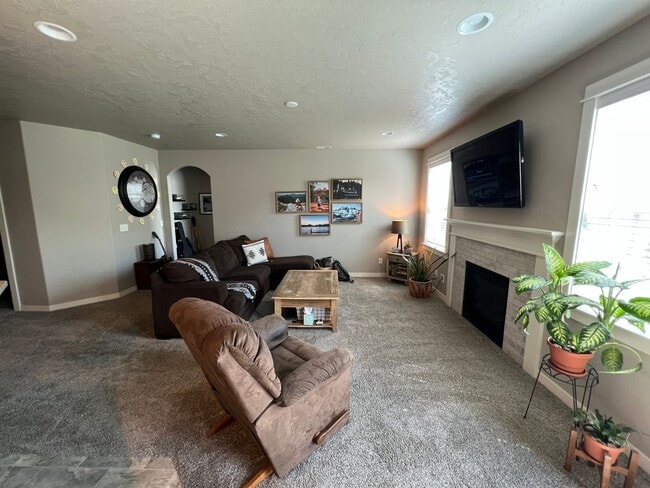 Building Photo - Single level, triple car garage and A/C!
