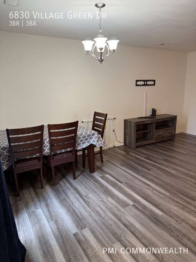 Building Photo - 6830 Village Green Dr