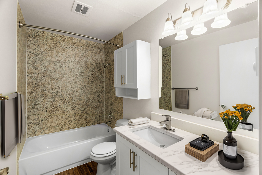 Experience the elegance and comfort of this thoughtfully designed bathroom space. - Chambers Pointe Apartments