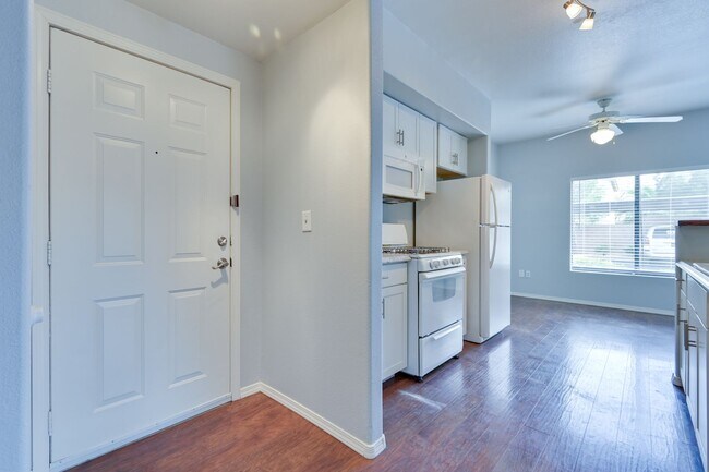 Building Photo - NW!! Gated!!! Clubhouse!!!Community Pool!!! 1st Floor Condo!!! Wood like floors!! No Carpet!!