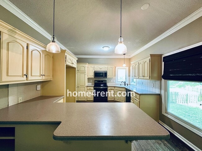 Building Photo - Blue Valley Schools w/ Wood Floors, Finished Basement and a Peaceful, Private Fenced Yard!